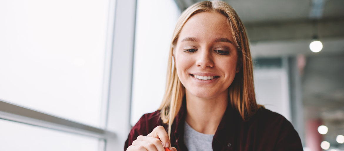 Young woman writing CV